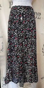 Bright floral print skirt, elasticated waist and coconut wood buttons. Flattering flowing fit.